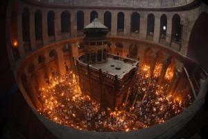 Worshippers hold candles as they take part in the Christian Orthodox Holy Fire ceremony at the Church of the Holy Sepulchre in Jerusalem's Old city